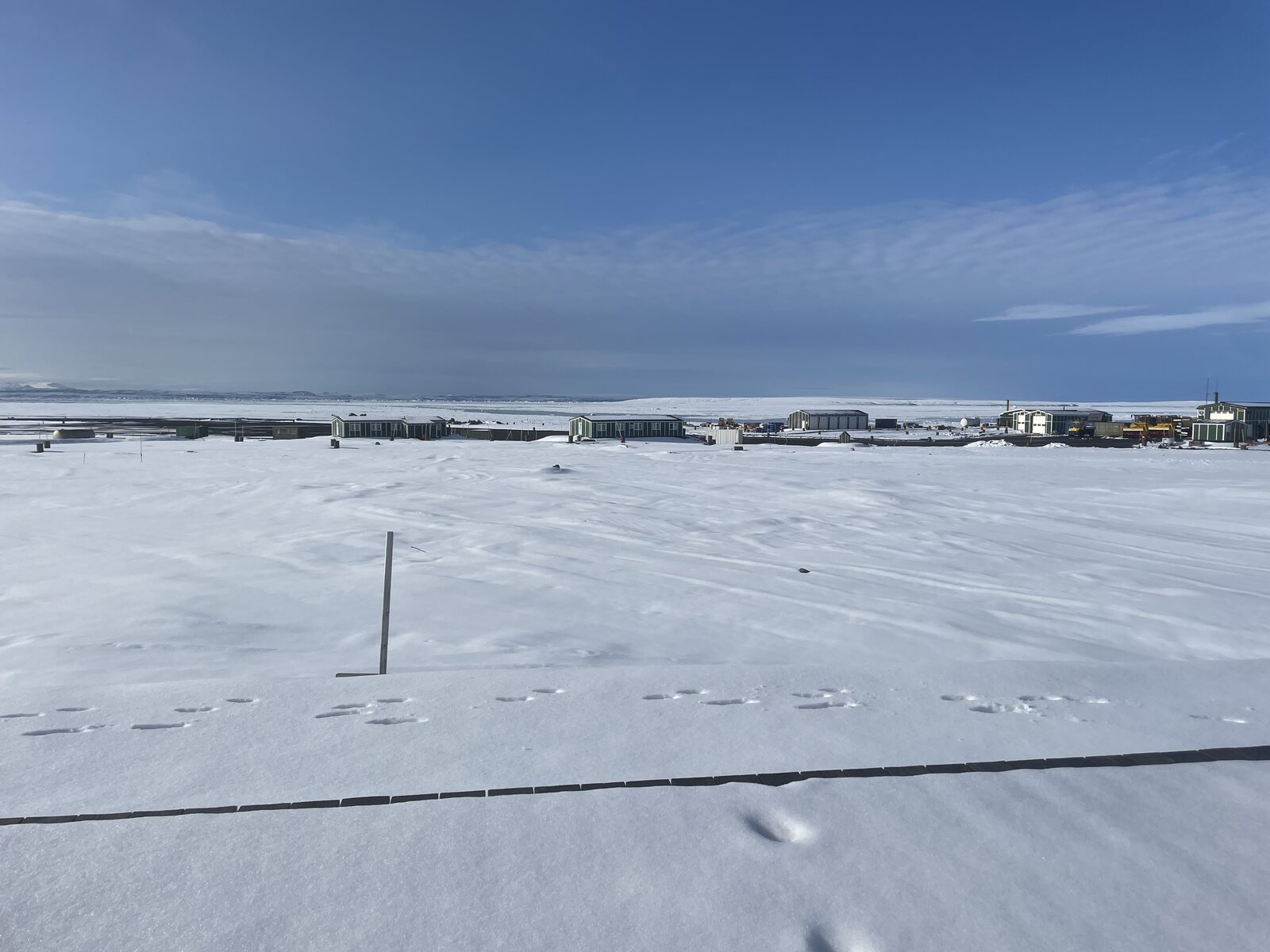 Villum Research Station buildings across snow-covered ground at Station Nord, NE Greenland